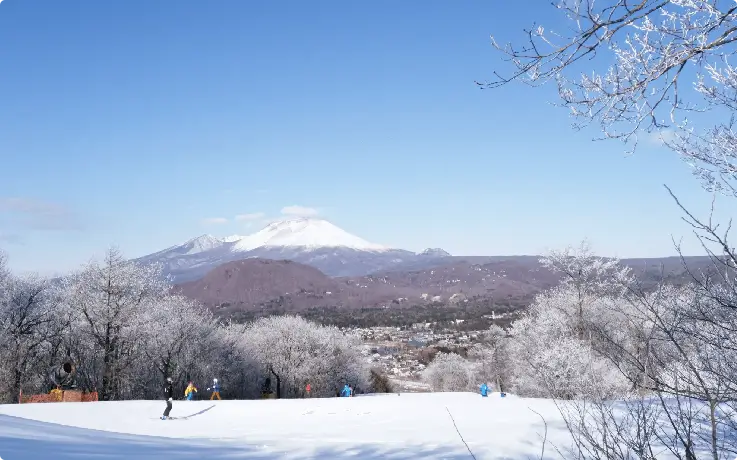Beautiful snow-covered slopes with mountain views at Karuizawa Prince Hotel Ski Resort.